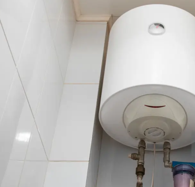 Wall-mounted water heater installed above a tiled bathroom wall in Tempe