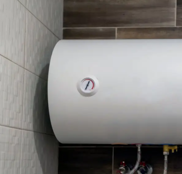 Horizontal wall-mounted water heater with pressure gauge and supply lines
